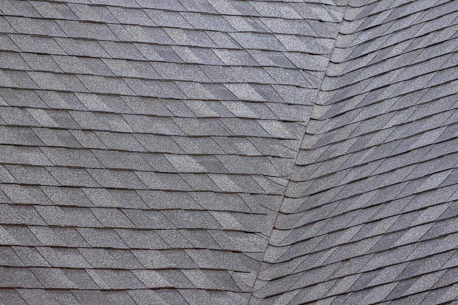 Close-up of new black architectural shingles installed by Alpine Roofing
