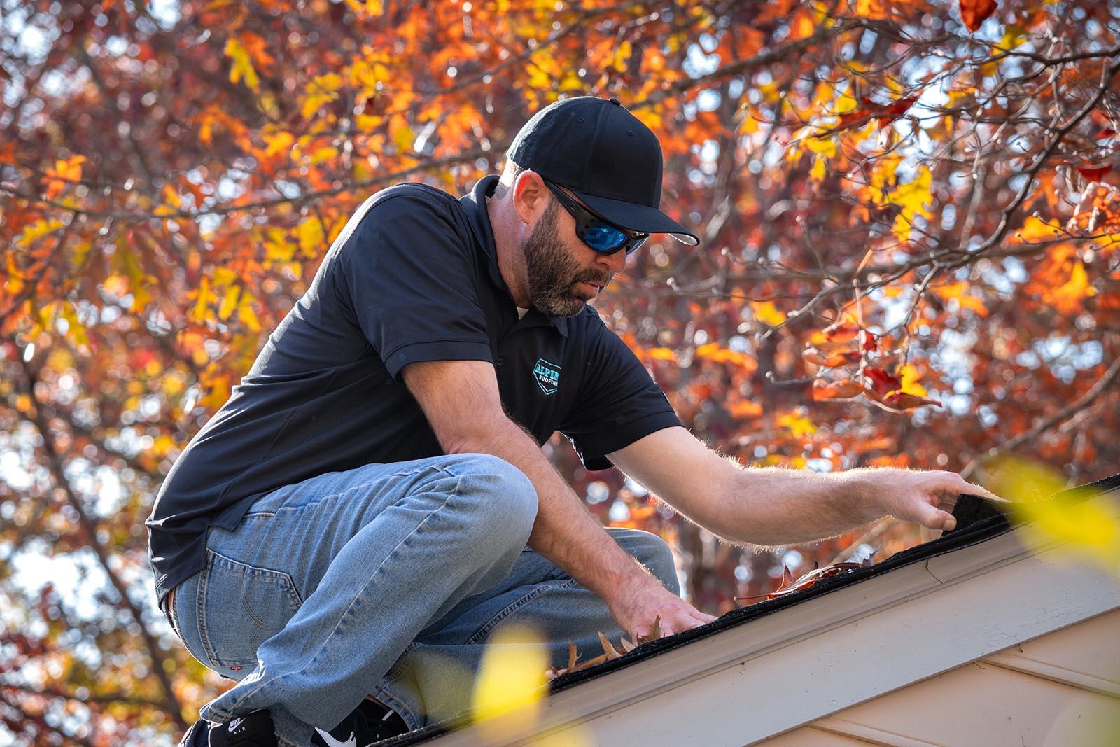 Alpine Roofing crew member working on a roof in Williamsburg, VA